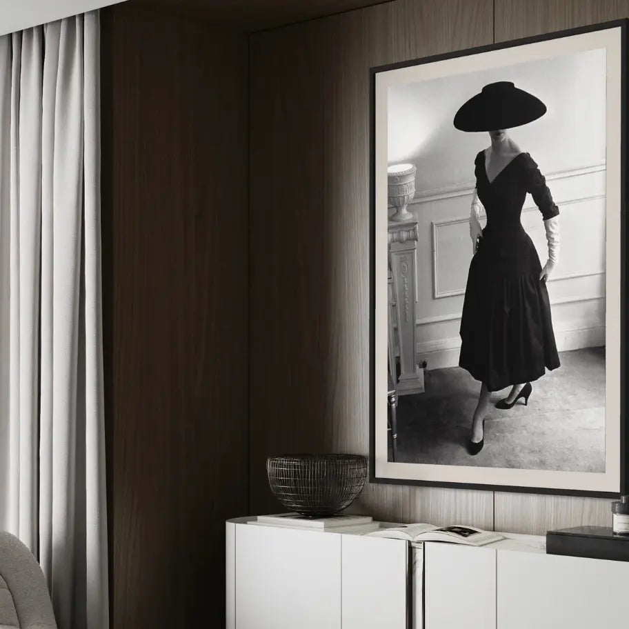 a black and white photograph on an elegant model framed in a neutral hotel room-The Picturalist