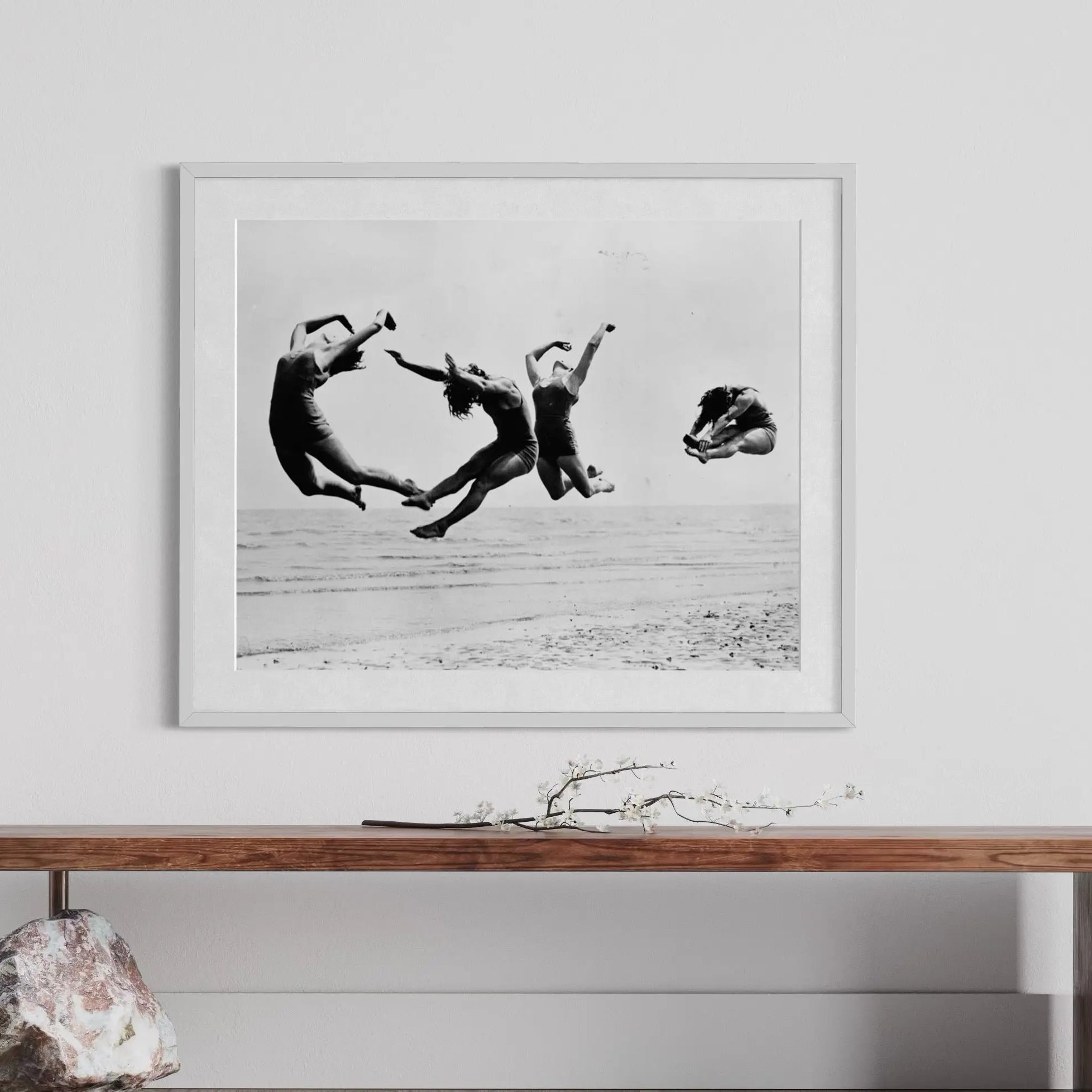 framed photography by Getty Images of dancers jumping at the beach