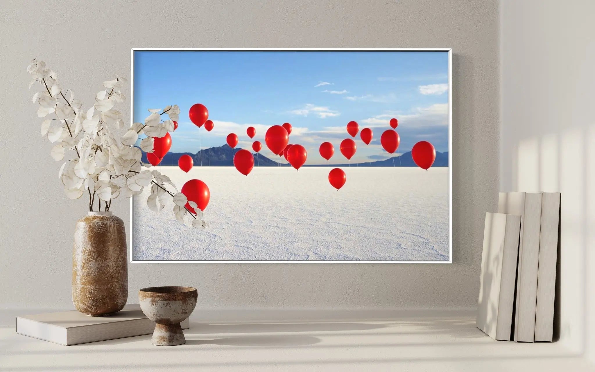 Red Balloons on Salt Flats by Andy Ryan presented in a curated interior design