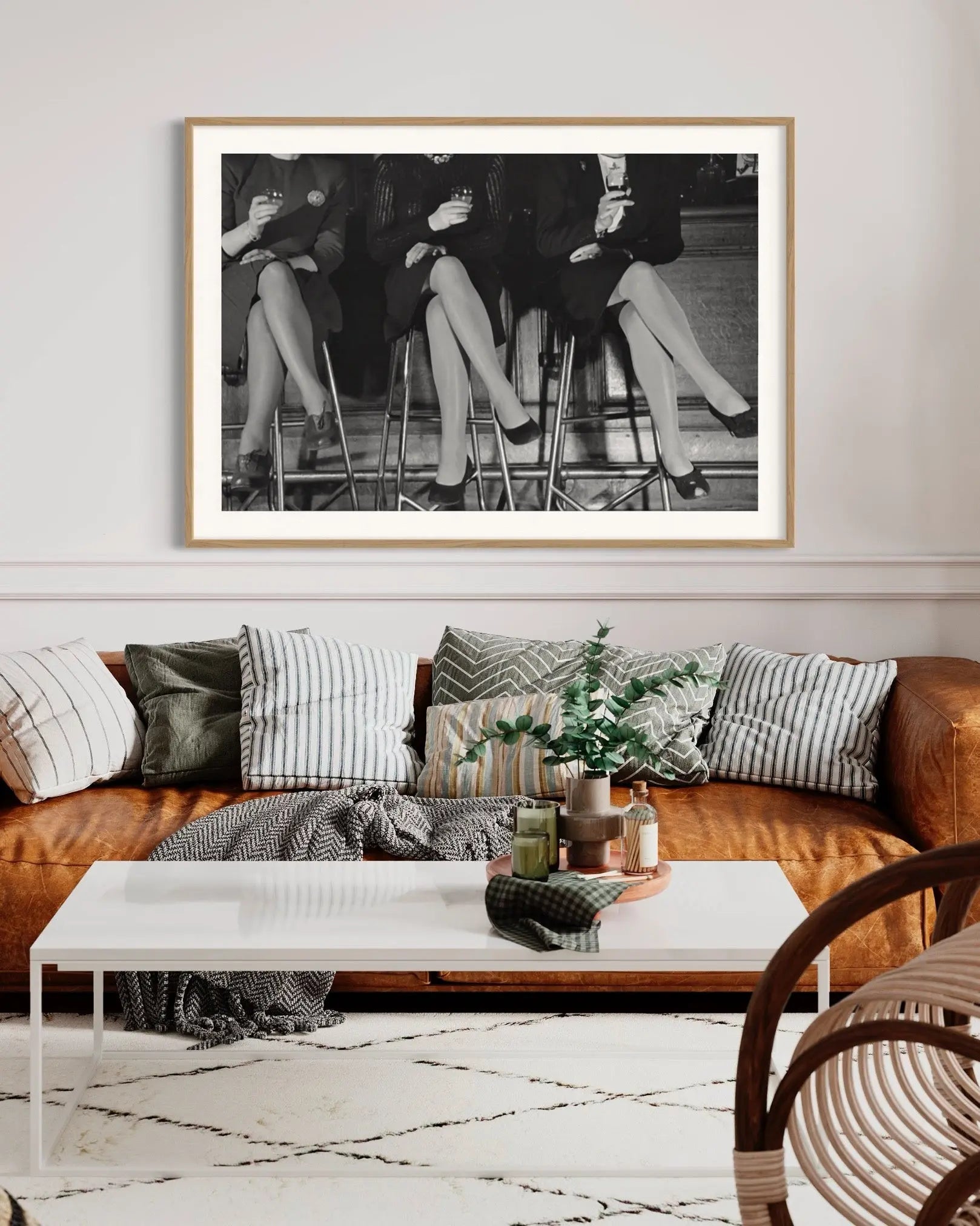 Three Pairs of Stockinged Legs 1946 by Kurt Hutton displayed in a modern living room interior