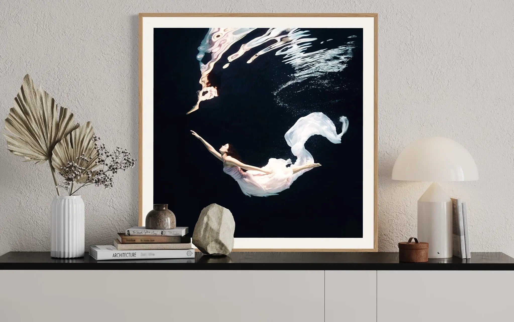 Ballet Dancer Underwater by Henrik Sorensen displayed in a modern living room interior