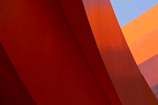 Flow I by Tal Paz-Fridman — fine-art photograph of converging lines in blue, red and orange tones