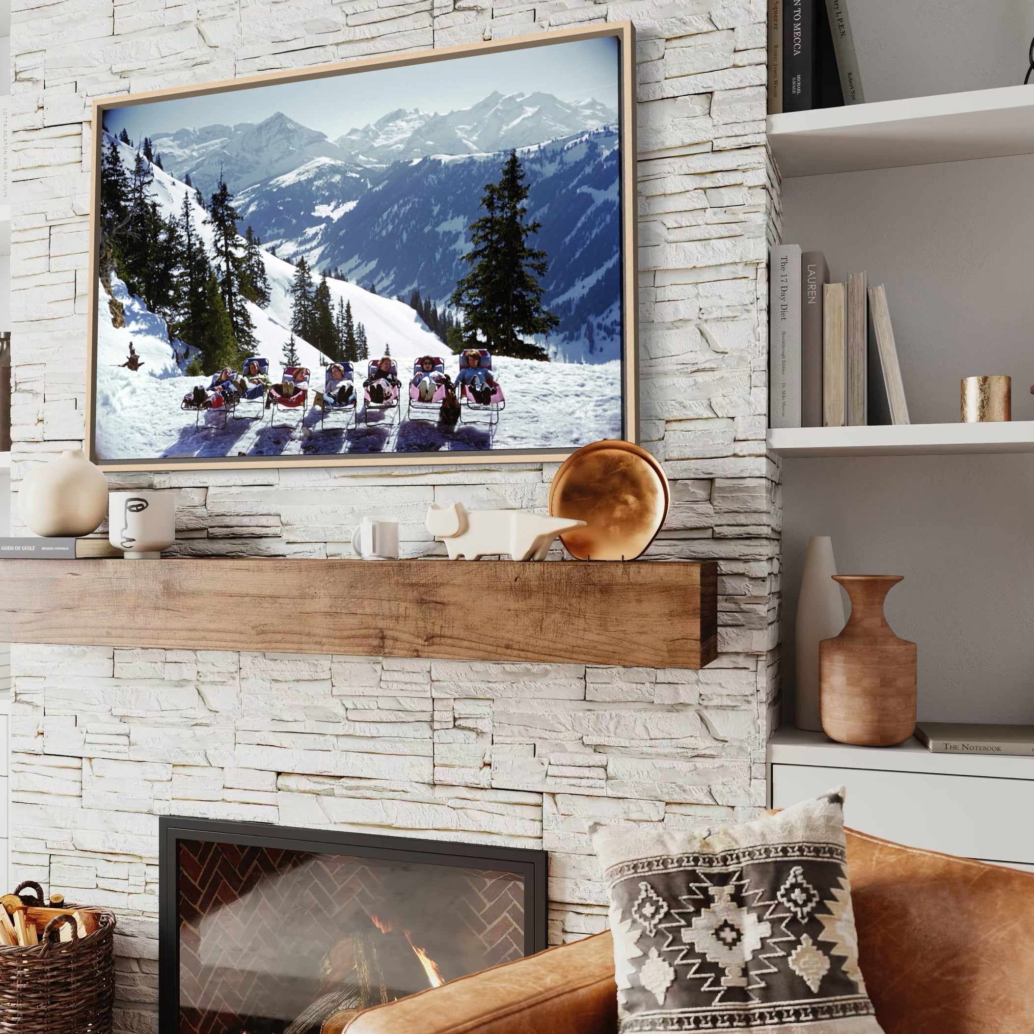 Living room with stone fireplace, TV showing mountain scene, and decorative items.
