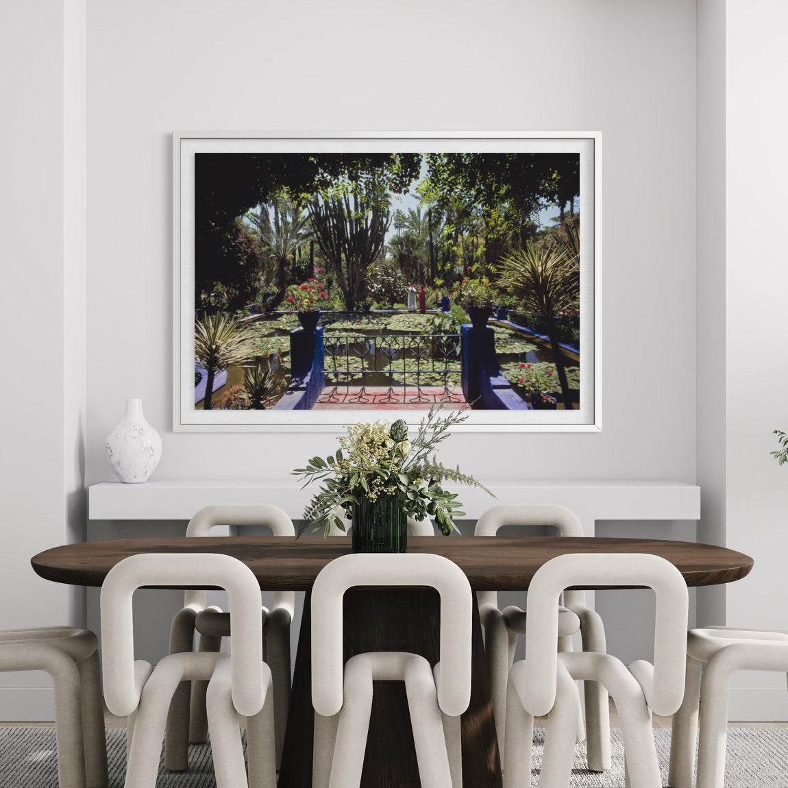 Colorful Marrakech garden photography by Slim Aarons above a contemporary dining room console