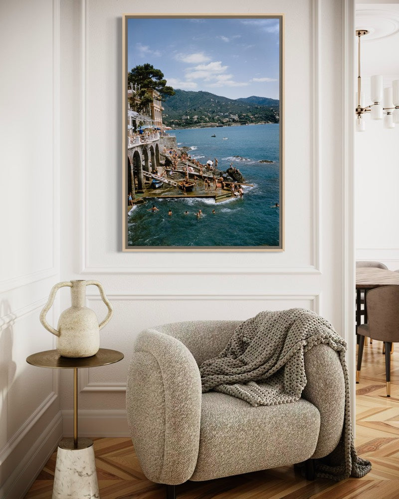 Rapallo, Italy by Slim Aarons featured in a gallery-style hallway, celebrating iconic Mediterranean destinations and luxury travel photography.