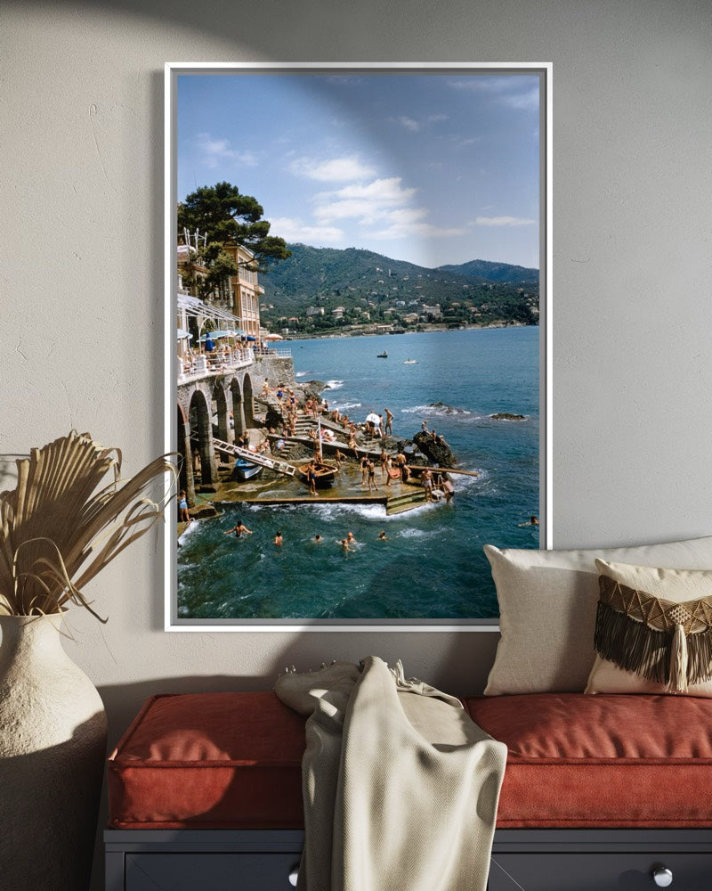 Rapallo, Italy by Slim Aarons featured in a gallery-style hallway, celebrating iconic Mediterranean destinations and luxury travel photography.