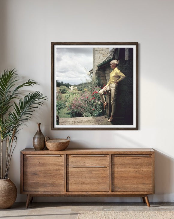 The Mason's Estate, Kenya by Slim Aarons framed above a credenza creating a refined atmosphere inspired by African landscapes and luxury travel.