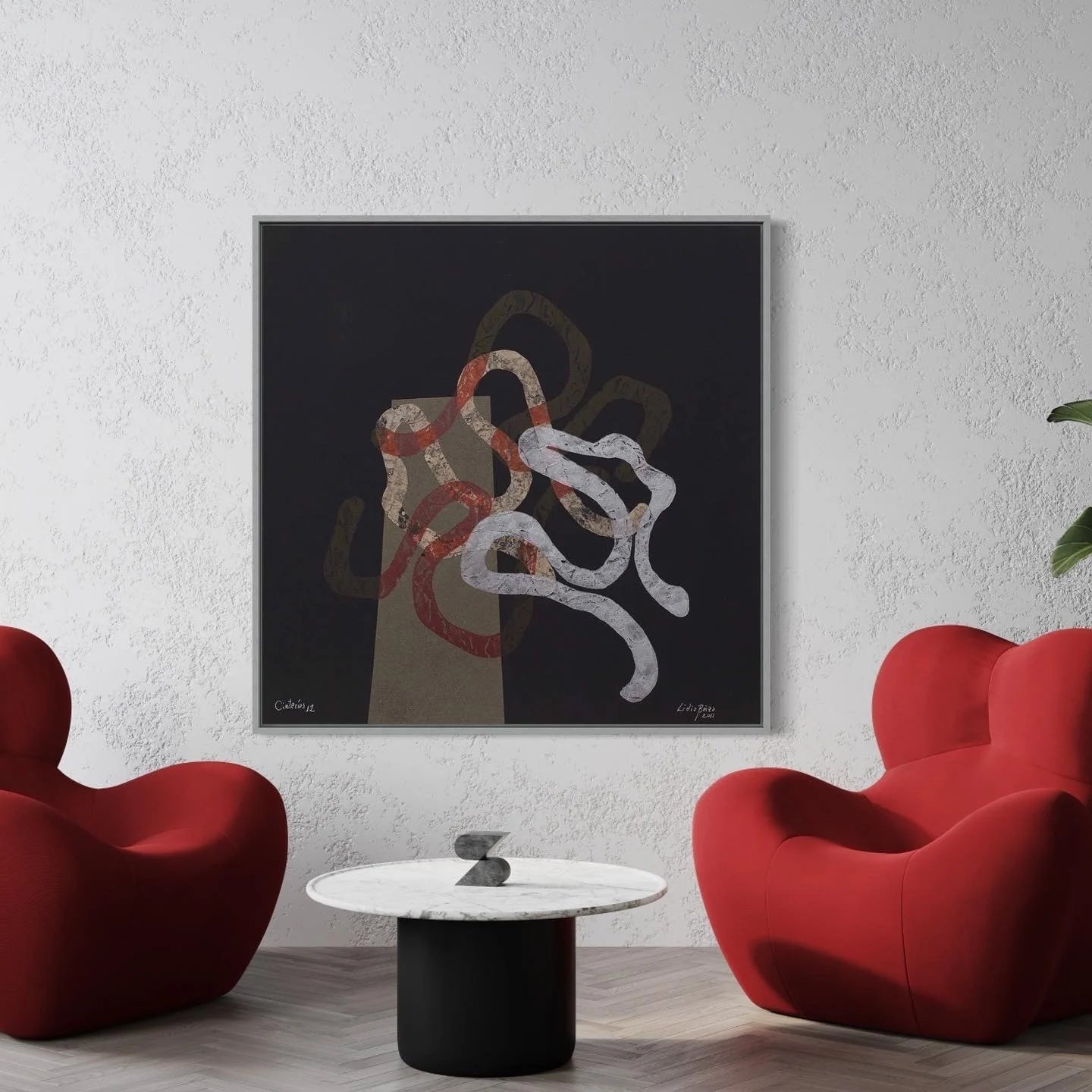 Modern living room with red chairs, a marble table, and abstract art on the wall.