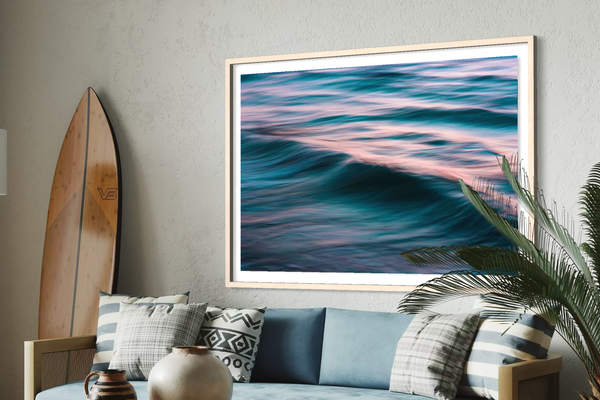 Living room with a blue sofa, wooden coffee table, and framed artwork of wavy colors.