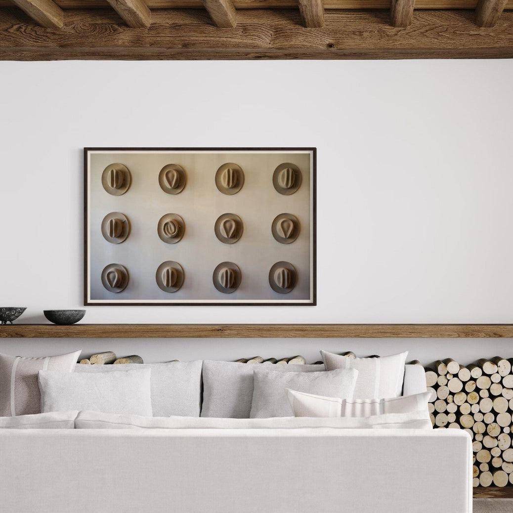 Twelve Hats of the Frontier displayed in a modern living room, designer-grade Americana wall art by The Picturalist