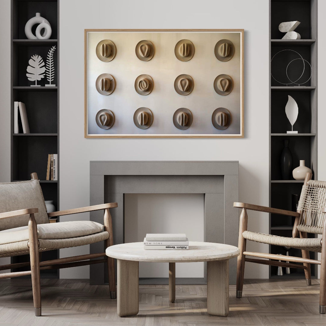 Twelve Hats of the Frontier presented in a contemporary office, sculptural Americana artwork by The Picturalist.