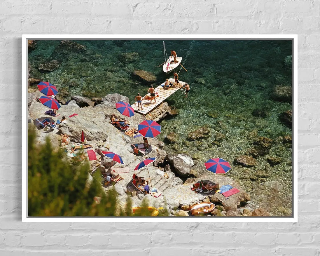 Beach at Il Pellicano by Slim Aarons displayed in a modern living room interior
