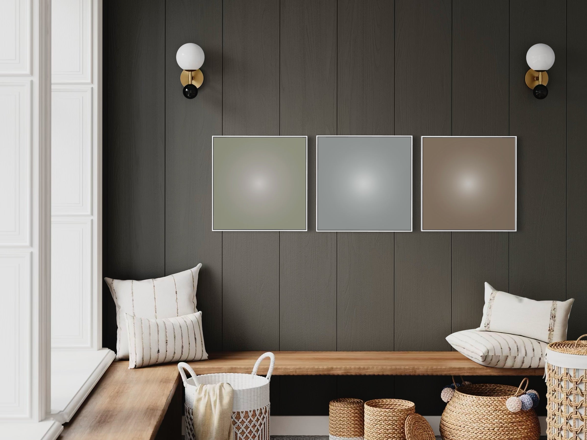 Wall with three color abstract metal prints and a wooden bench with pillows.