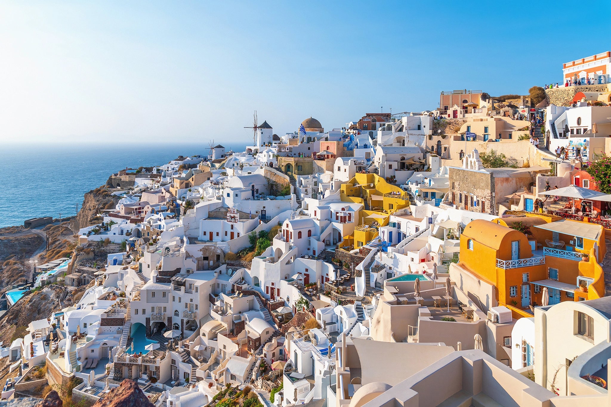 Beautiful View of Oia in Santorini by George Pachantouris, fine art photograph of whitewashed homes and Aegean Sea, framed by The Picturalist