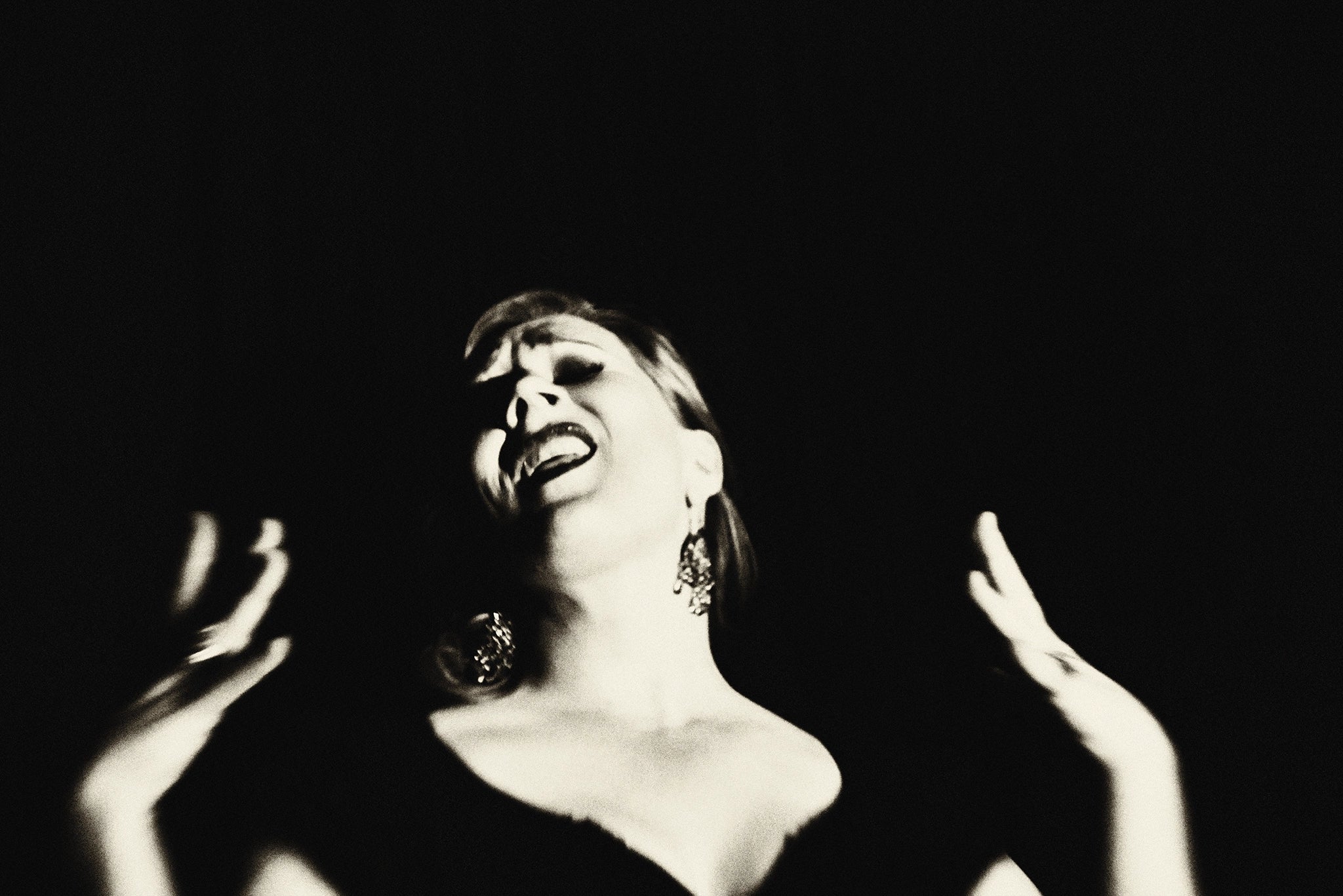 The Great Singer by Suteishi, expressive black and white portrait of woman singing, fine art print on matte paper framed by The Picturalist.