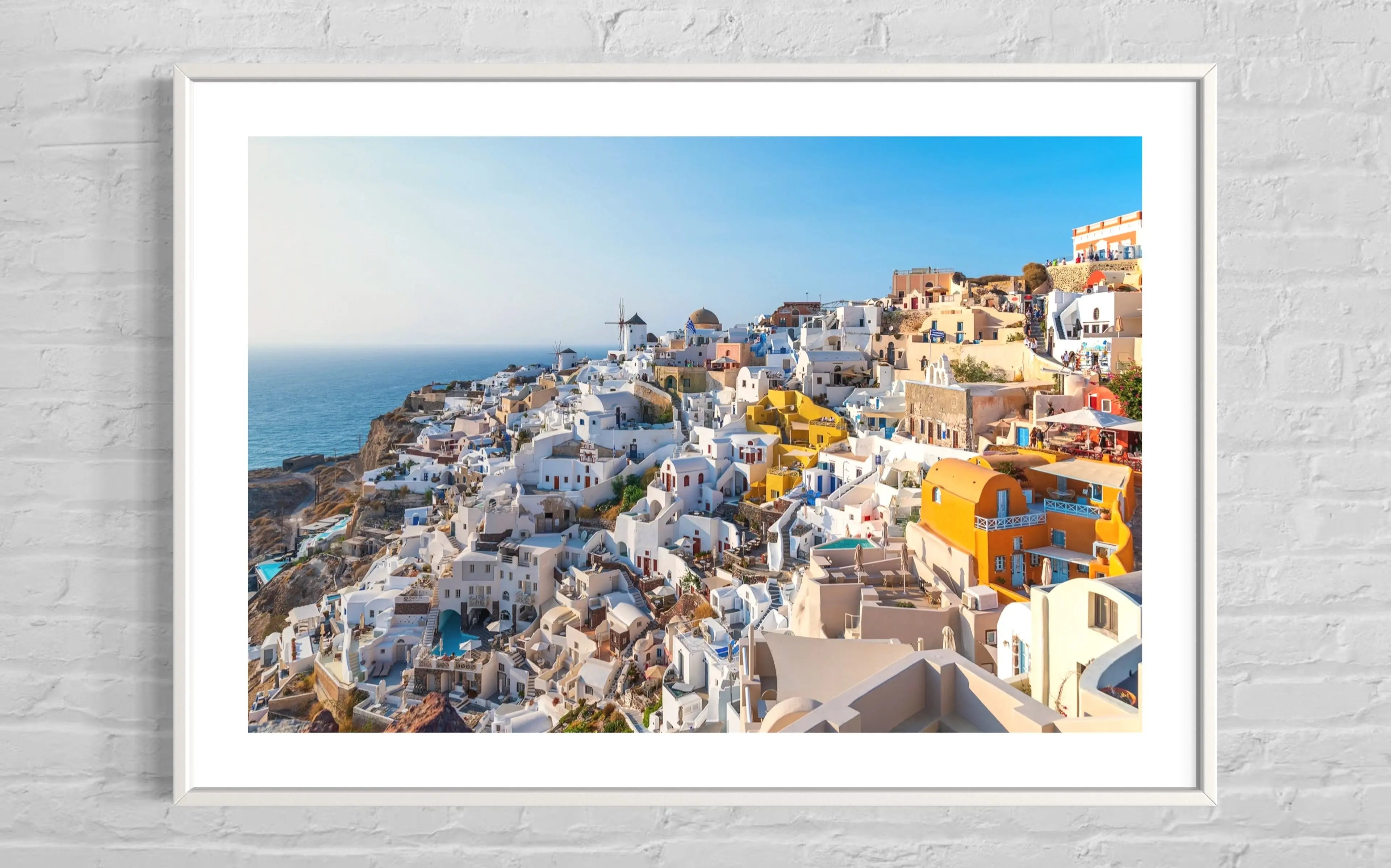 Beautiful View of Oia in Santorini by George Pachantouris displayed in a modern living room interior