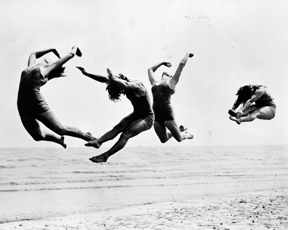 Beach Dance by Reg Speller — vintage black and white fine art photograph from Getty Images (asset #3426785). Available from The Picturalist, specialists in luxury wall art and framed fine art photography for designed interiors.