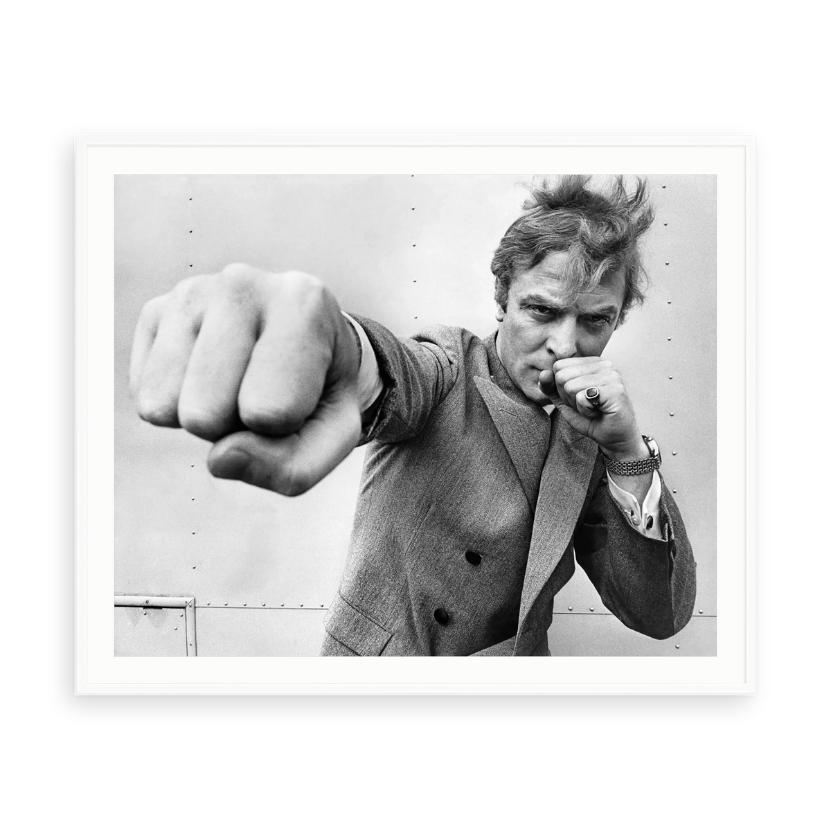 Michael Caine Throwing A Punch by Stephan C. Archetti — illustrative matte-white framed paper print with white mat; proportions vary by size.