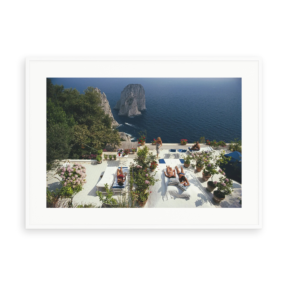 Illustrative matte-white framed preview with white inner border of Il Canille by Slim Aarons. Proportions vary by size.
