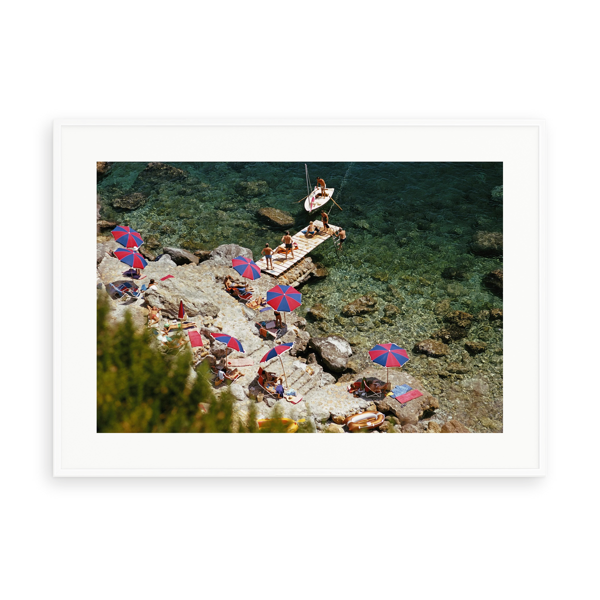 Illustrative matte-white framed preview with white inner border of Beach at Il Pellicano by Slim Aarons. Proportions vary by size.