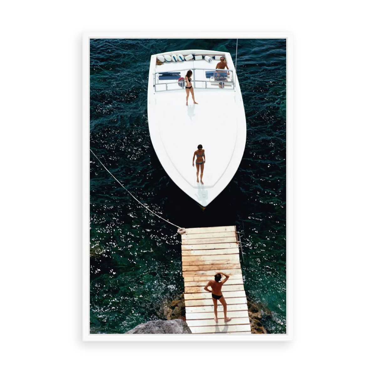 Illustrative matte-white floater-framed preview, without added mat, of Speedboat Landing by Slim Aarons. Proportions vary by size.