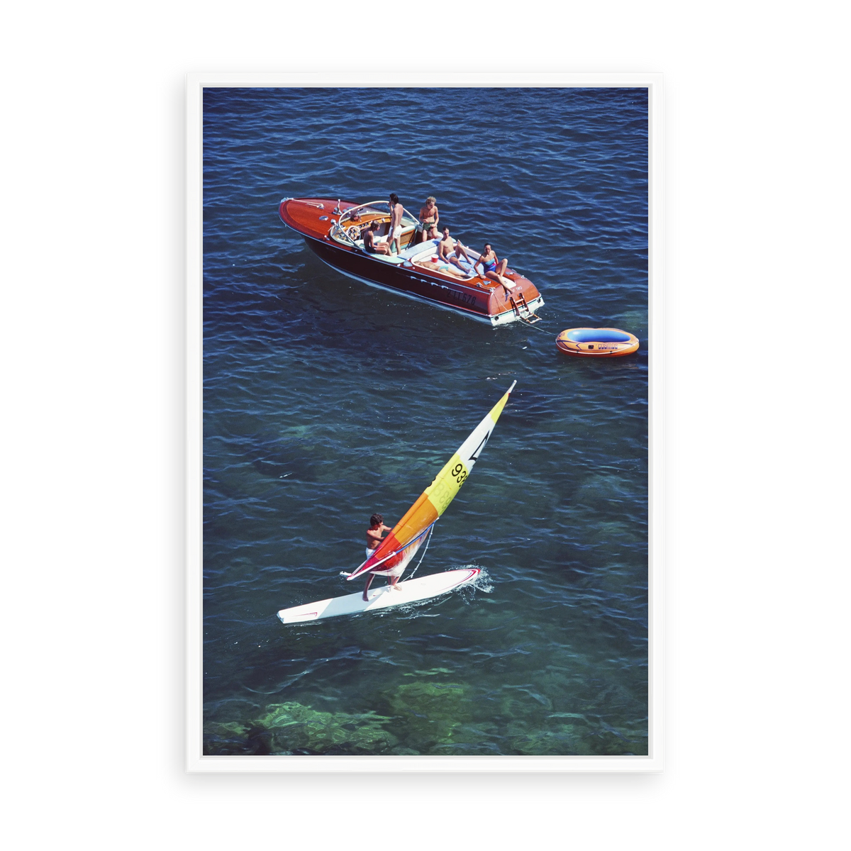 Illustrative matte-white floater-framed preview, without added mat, of Windsurf in Porto Ercole by Slim Aarons. Proportions vary by size.