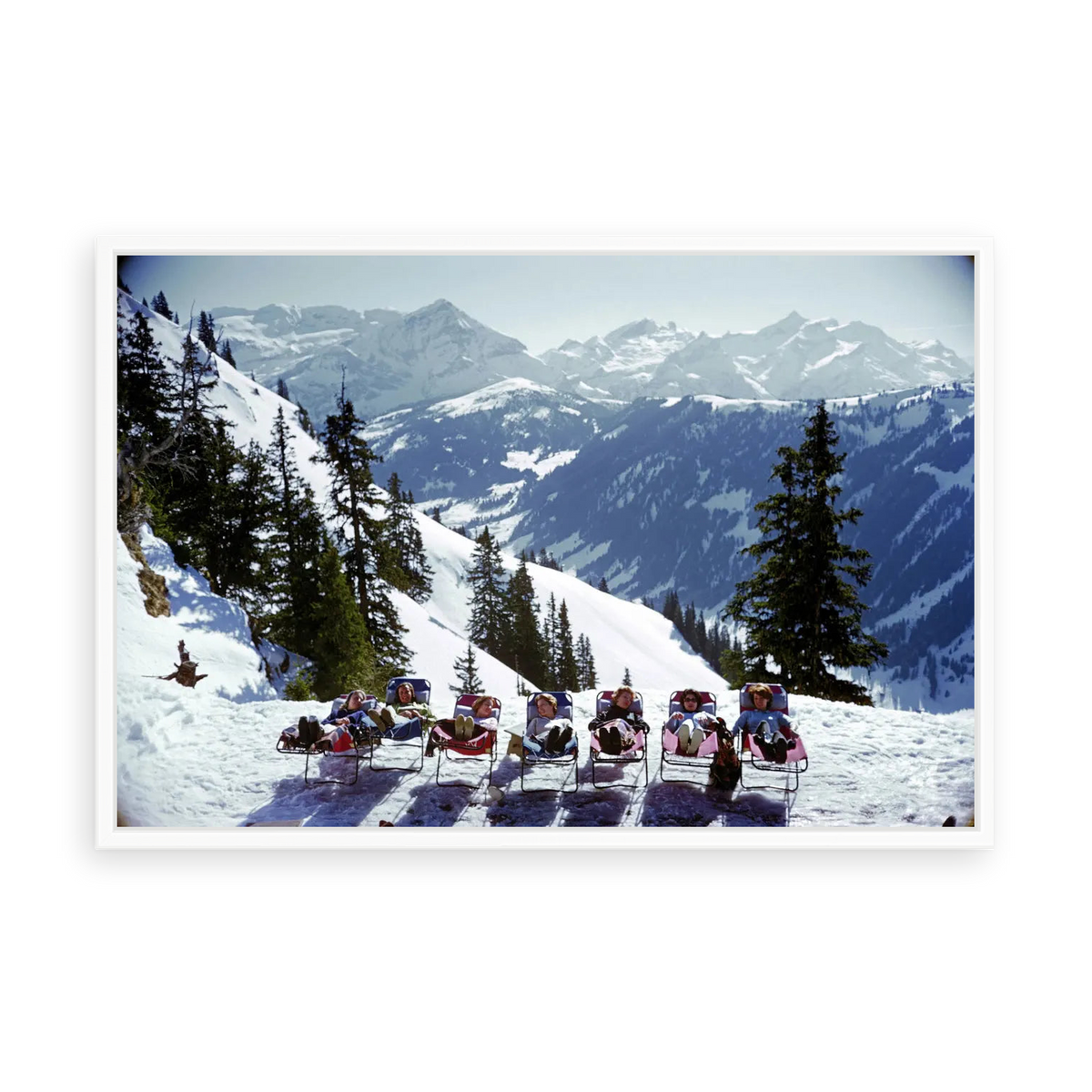 Illustrative matte-white floater-framed preview, without added mat, of Lounging in Gstaad by Slim Aarons. Proportions vary by size.