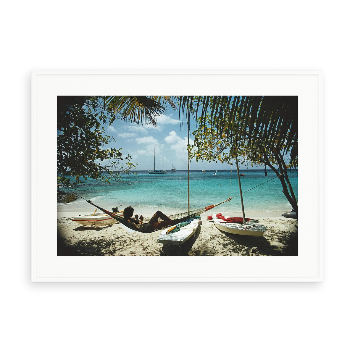 Illustrative matte-white framed preview with white inner border of Mustique by Slim Aarons. Proportions vary by size.