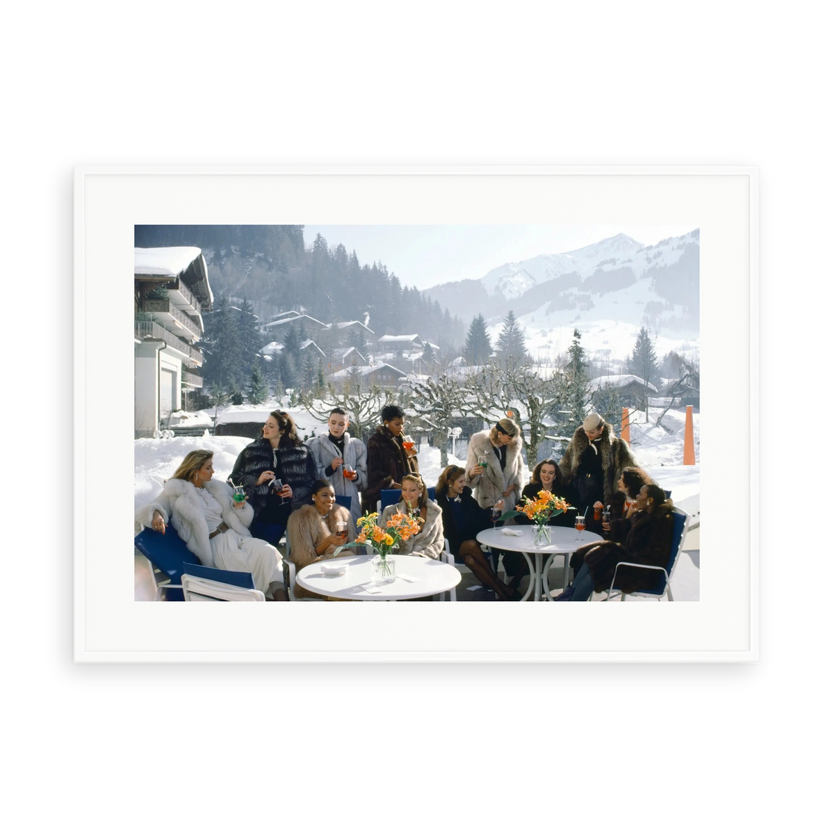 Illustrative matte-white framed preview with white inner border of Drinks At Gstaad by Slim Aarons. Proportions vary by size.