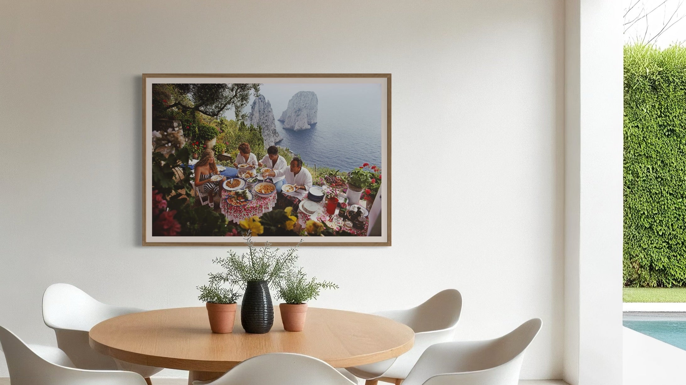 Dining Al Fresco by Slim Aarons shown in a boutique hotel lounge, delivering framed art for hospitality and aesthetic solutions for hospitality designers.