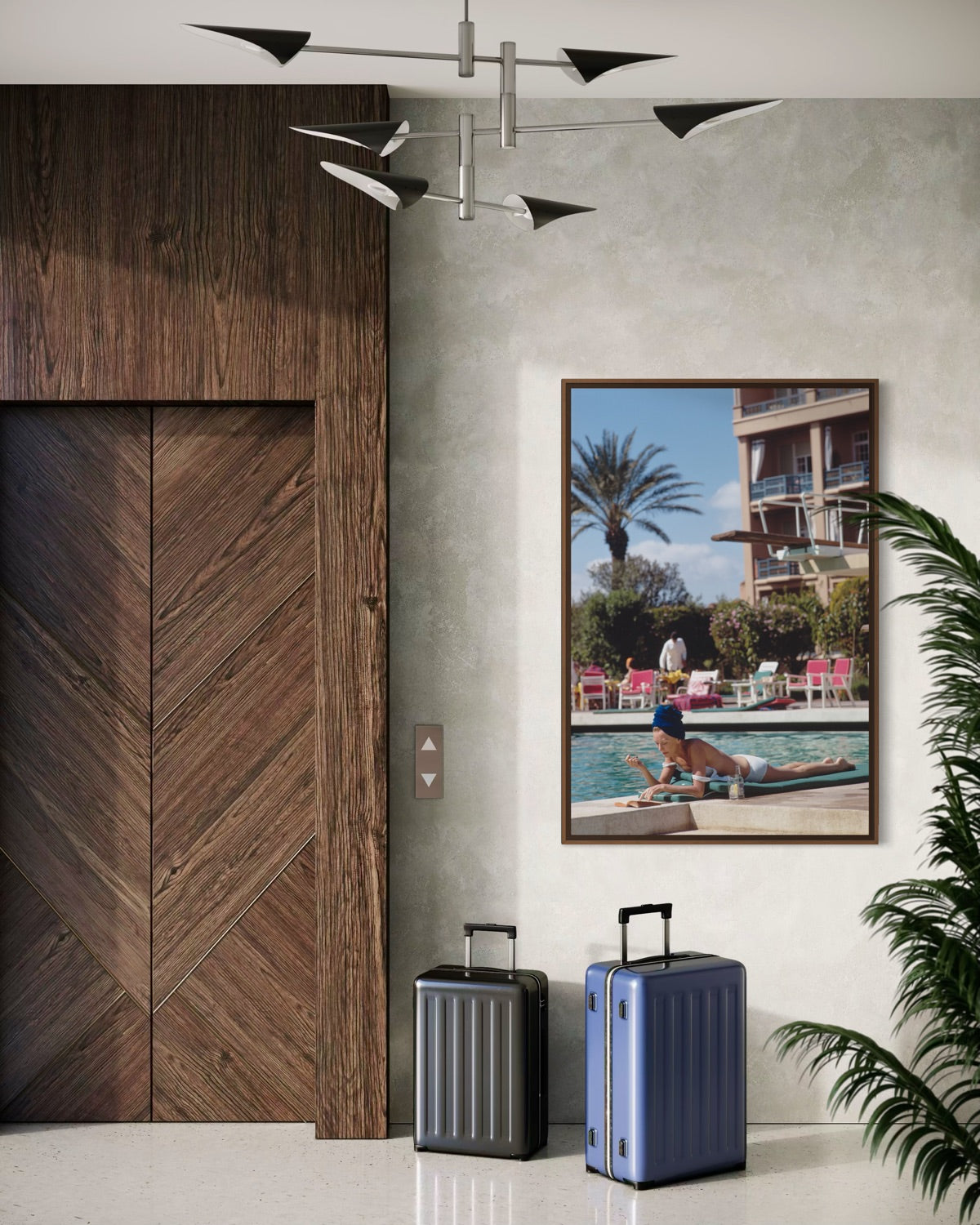 Two suitcases in a modern interior setting with a wooden door and Poolside in Marrakesh Morocco by Slim Aarons featuring elegant resort leisure and Moroccan architecture in a luxury poolside setting.