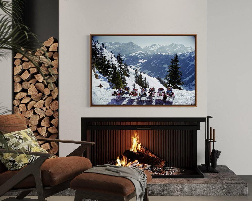 Lounging in Gstaad by Slim Aarons framed in a contemporary living room, offering tailored art solutions and designer-grade wall decor for luxury residential interiors.