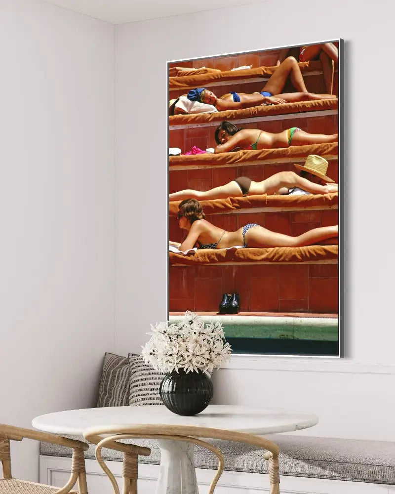Sunbathing in Capri by Slim Aarons presented in a curated interior design