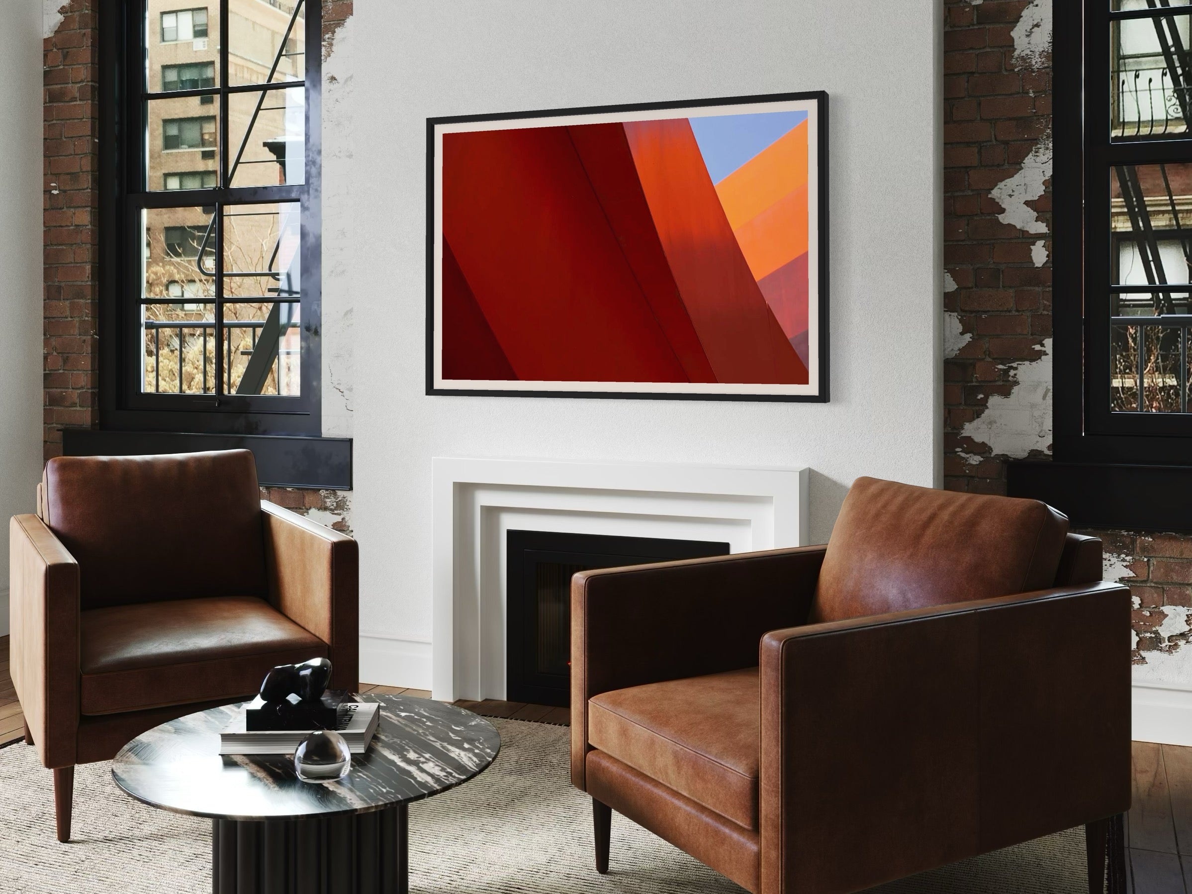 Living room with two brown leather chairs, a small round table, and a colorful abstract painting on the wall.
