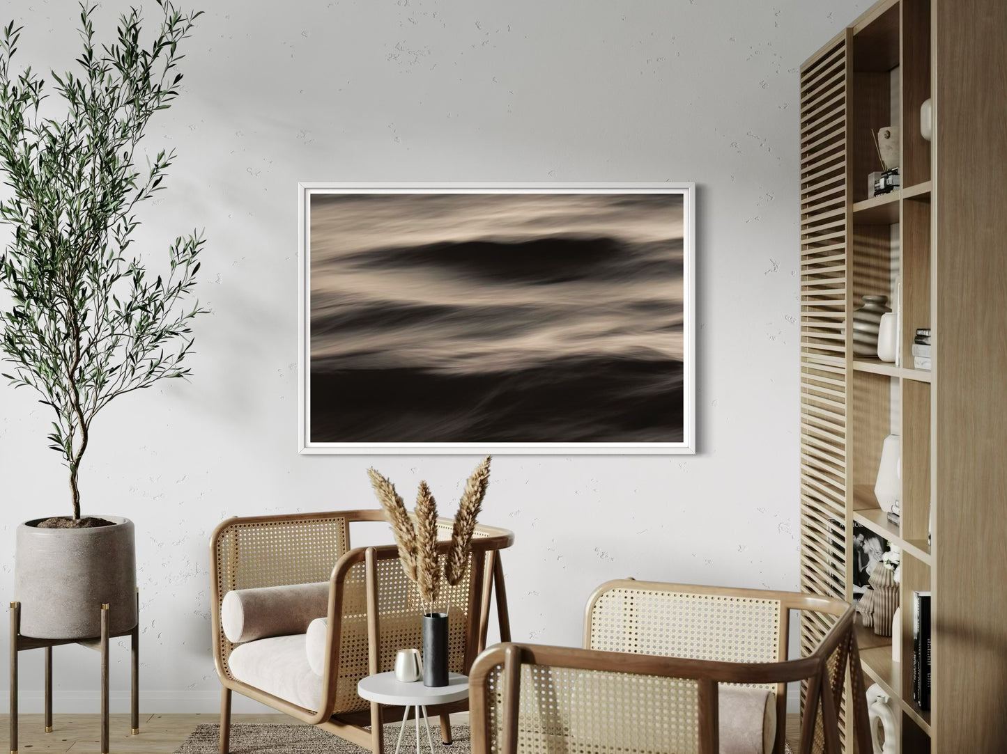 Modern living room with abstract artwork, chairs, and a plant.