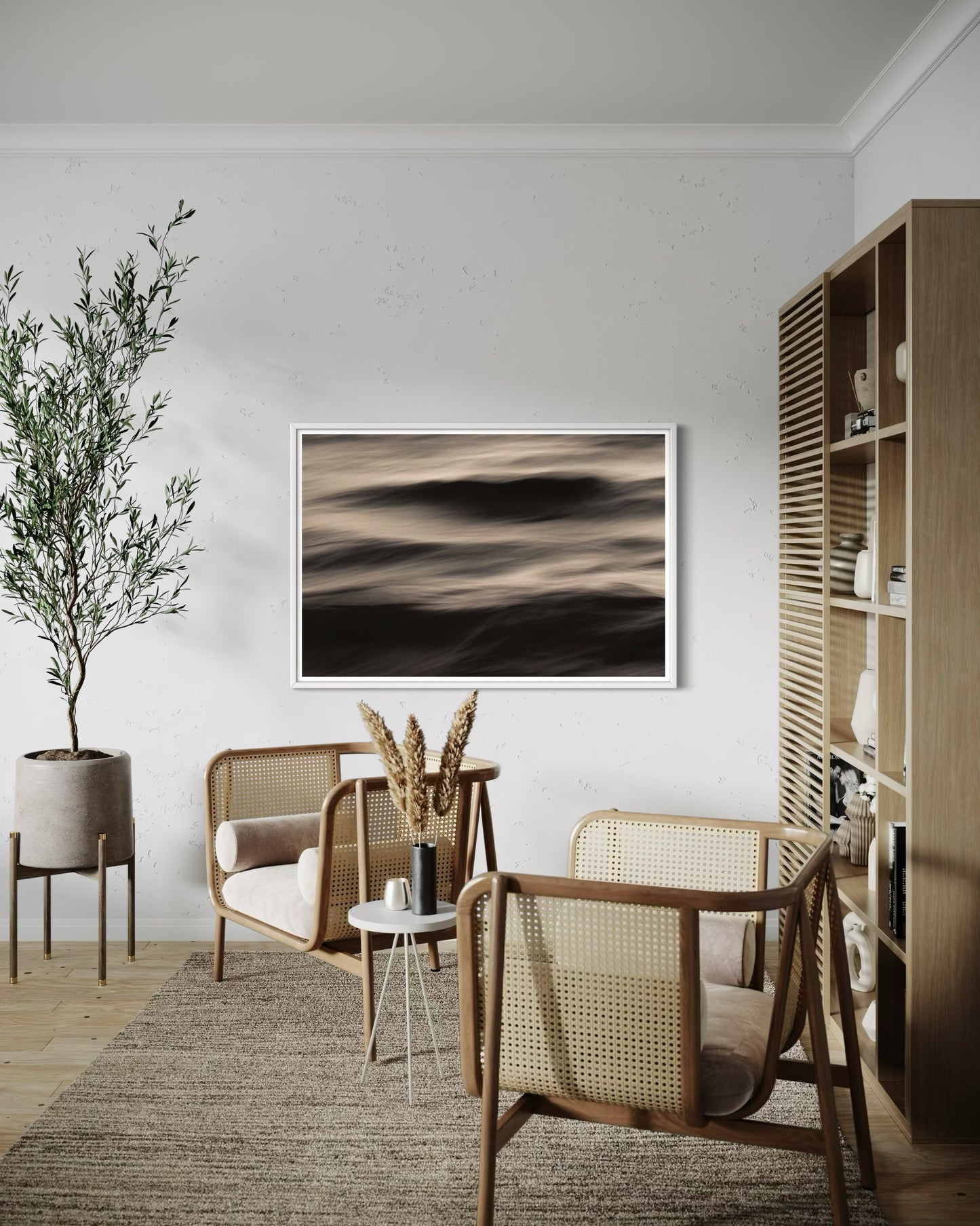 Modern living room with wicker chairs, a plant, and abstract art on the wall.
