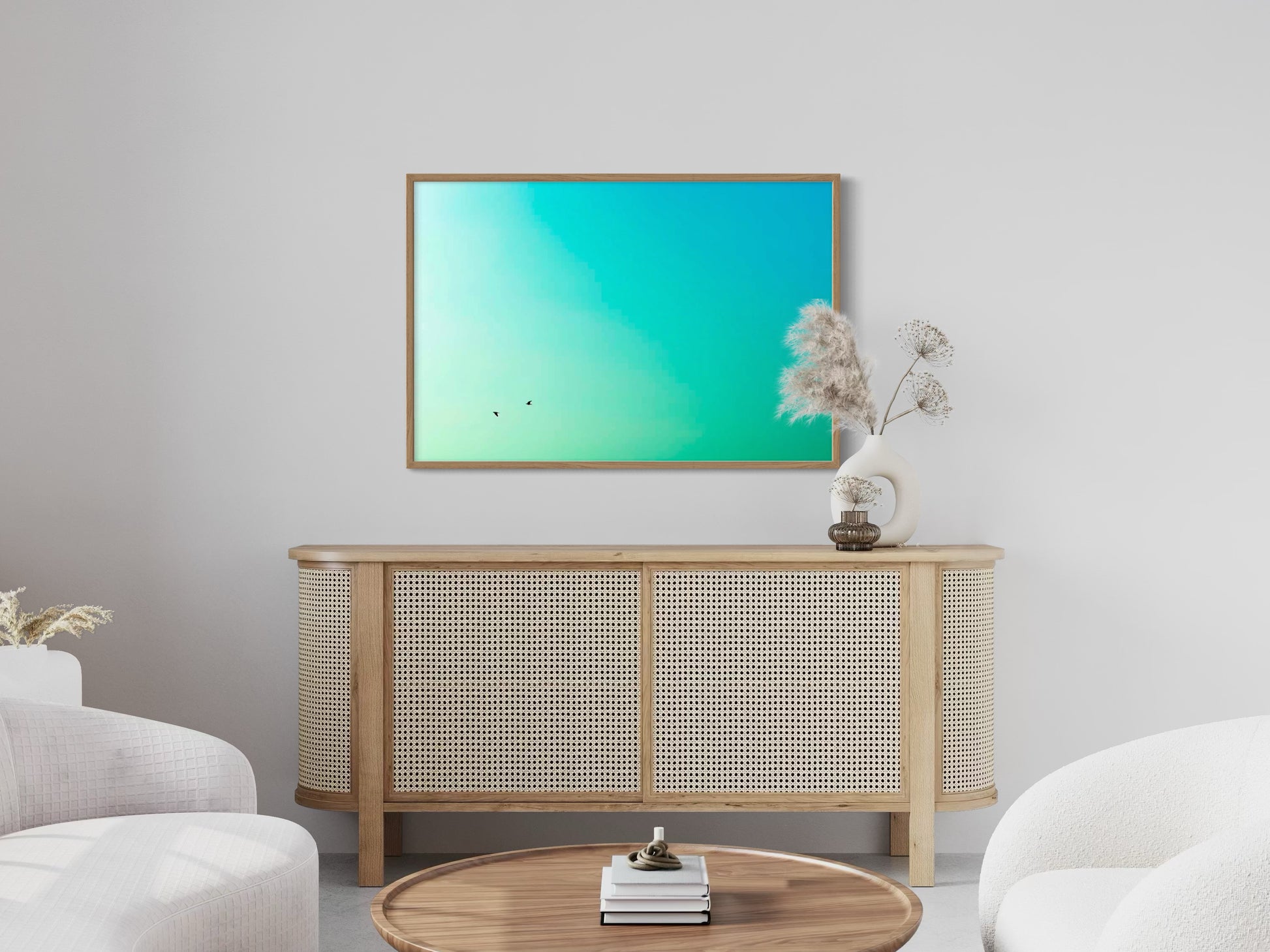 Modern living room with a wooden sideboard, white chairs, and a television displaying a green and turquoise gradient.