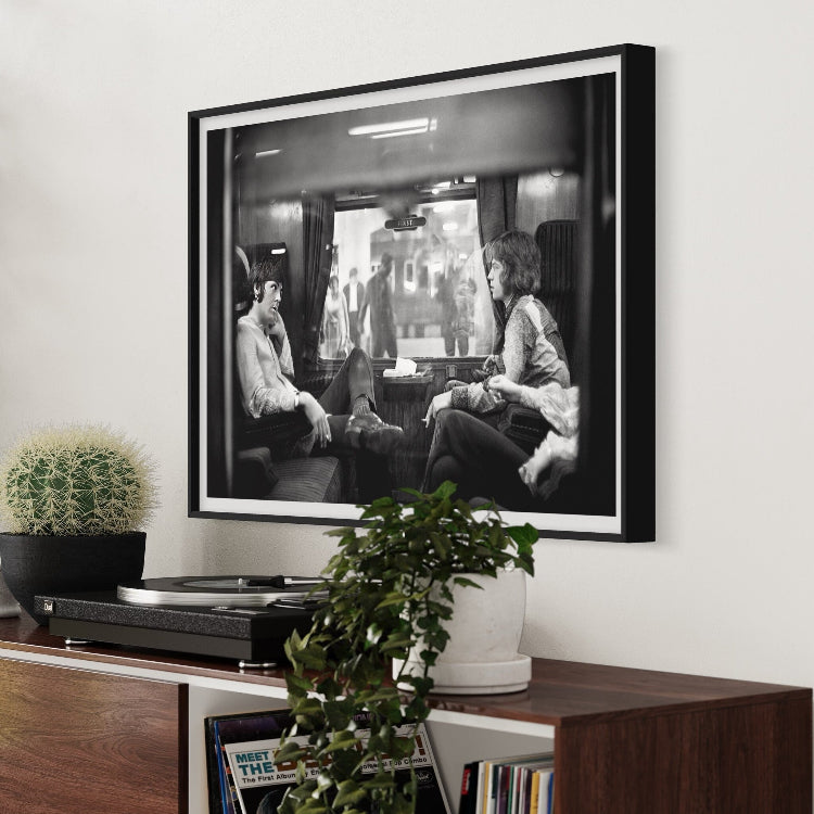 First Class Travel by Victor Blackman featured in a clean hallway gallery wall, ideal for real estate staging art and curated art collections.