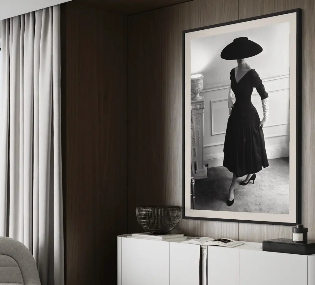a black and white photograph on an elegant model framed in a neutral hotel room-The Picturalist