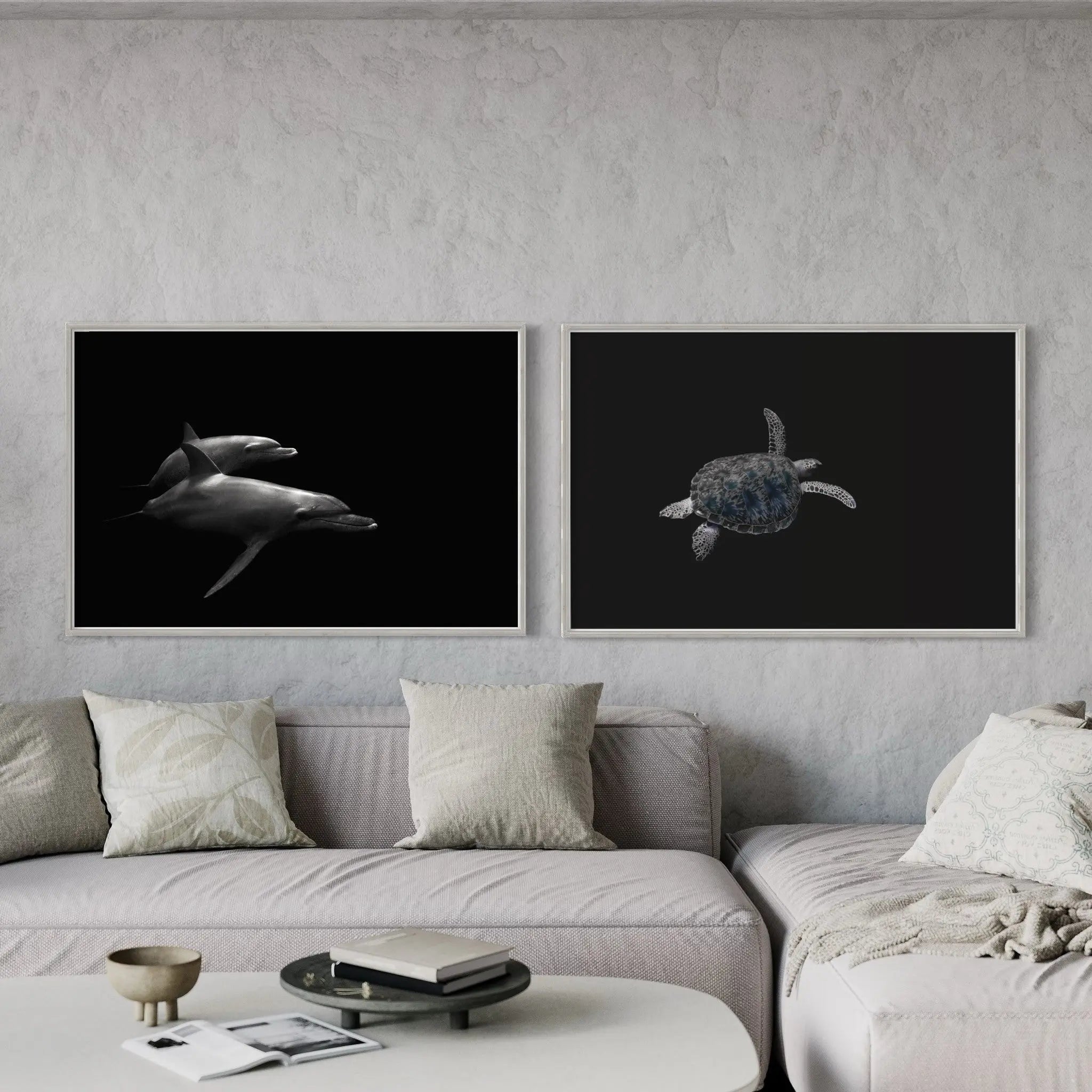 ap pair of photographs of 2 dolphins and one carey turtle decorating a neutral living-room