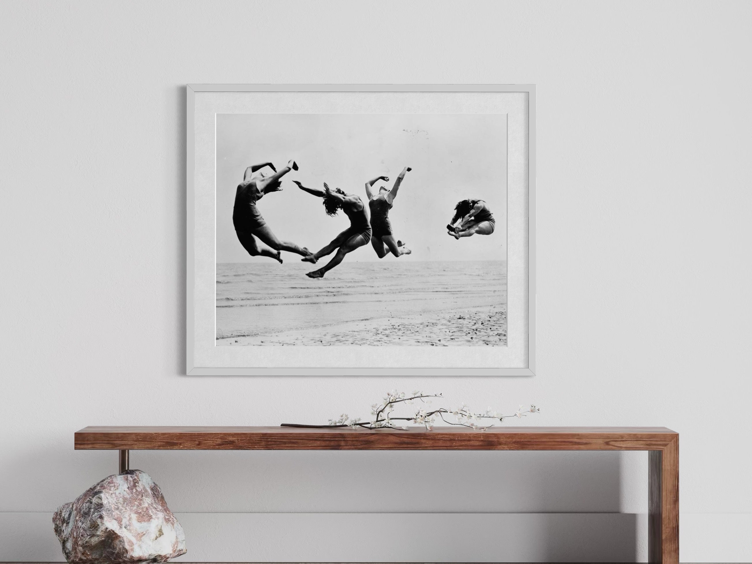 framed photography by Getty Images of dancers jumping at the beach