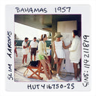 Vintage photo of people in Bahama attire with text 'Bahamas 1957' on a white border.