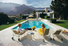 Palm Springs, Kaufman House, Two women sitting by a pool with mountains in the background