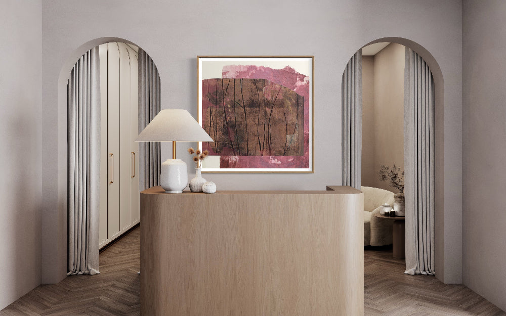 Abstract magenta and neutral canvas by Lidia Beiza styled above dcommercial space counter and soft neutral interior, The Picturalist