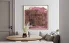Abstract magenta and neutral canvas by Lidia Beiza styled above dining seating with wood table and soft neutral interior, The Picturalist