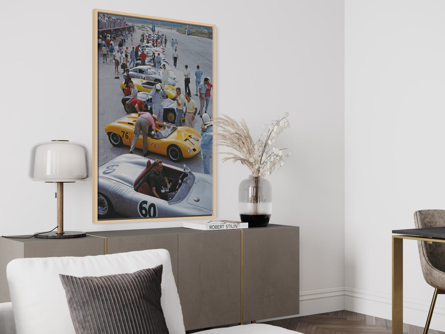 Framed artwork of a race car scene in a modern living room.