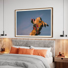 Luminous Cowboy Tale neon cowboy artwork shown above a contemporary bed setting, framed by The Picturalist