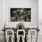 Colorful Marrakech garden photography by Slim Aarons above a contemporary dining room console