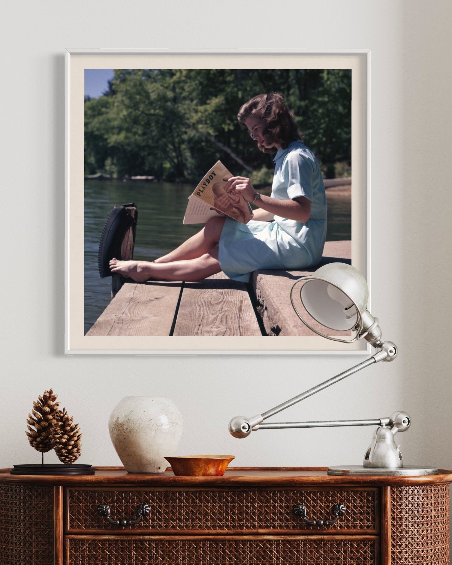 Playful Lakeside vintage photograph shown above a modern bed setting, framed fine art print curated by The Picturalist.