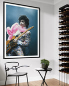 Prince Live at The Forum by Michael Ochs Archives, vibrant concert photograph of Prince performing in pink feathers and sequins, fine art print framed by The Picturalist